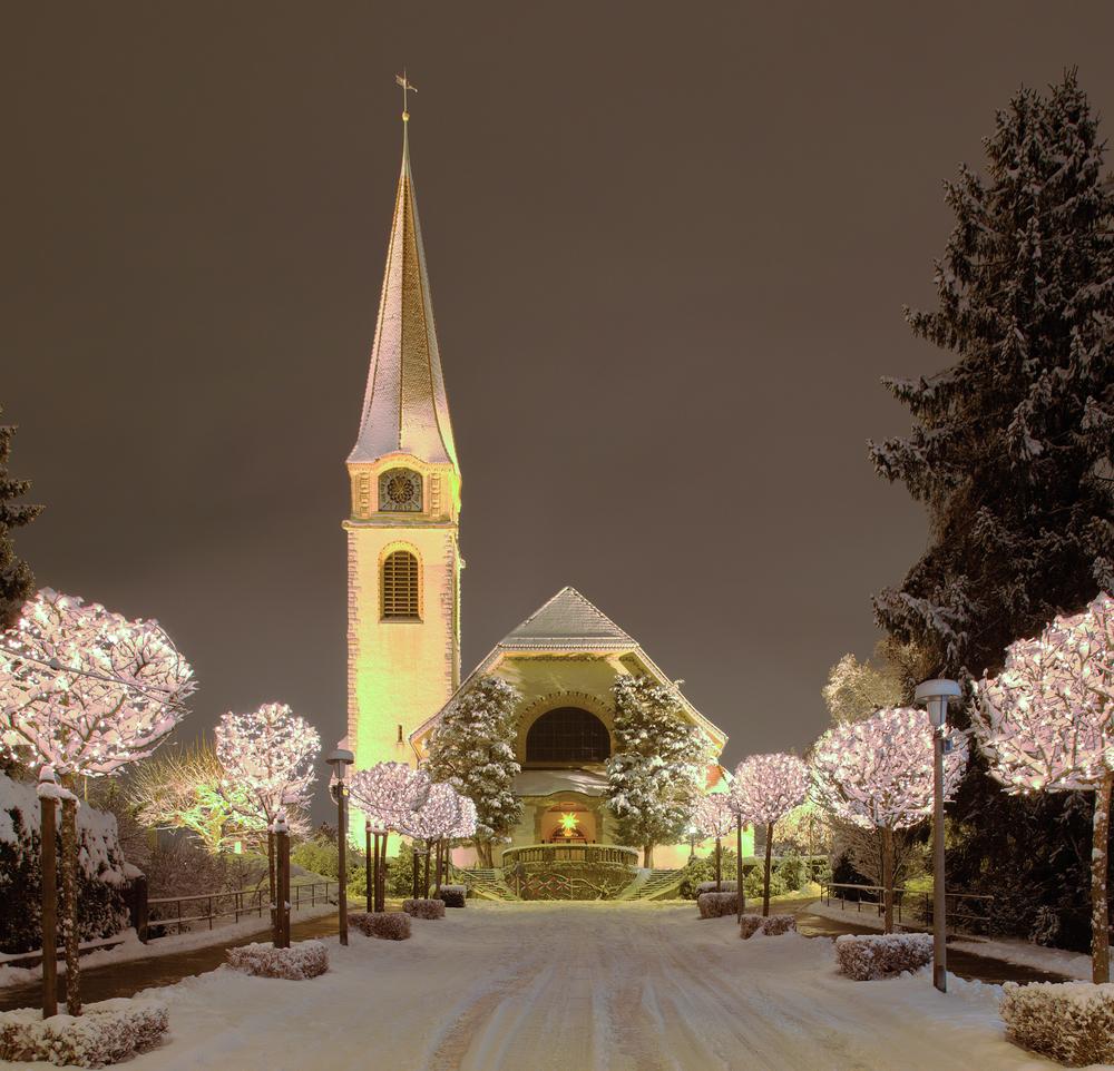 A street and church illuminated for Christmas in Zurich, Switzerland. (Judith Linine/Shutterstock)