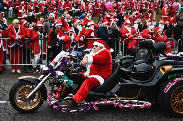 A man rides his motorbike during the 12th Santa Claus "Papa Noel" charity rally in Turin, Italy, on Dec. 4, 2022, to raise funds for a pediatrics health care facility. (Marco Bertorello/AFP via Getty Images)