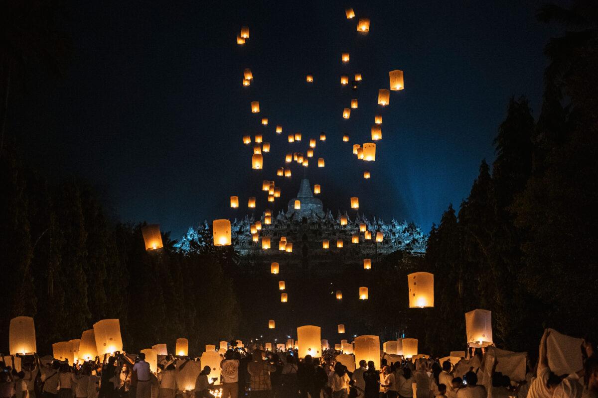 Buddhist devotees and tourists release lanterns into the air near the Borobudur temple during celebrations for Vesak Day in Magelang, Central Java, Indonesia, on May 16, 2022. (Ulet Ifansasti/Getty Images)