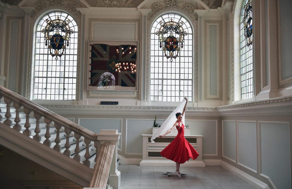 A dancer rehearses for a tea dance performance in Belfast City Hall in Ireland to mark the 70th anniversary of the accession of Queen Elizabeth II, on June 3, 2022. (Charles McQuillan/Getty Images)