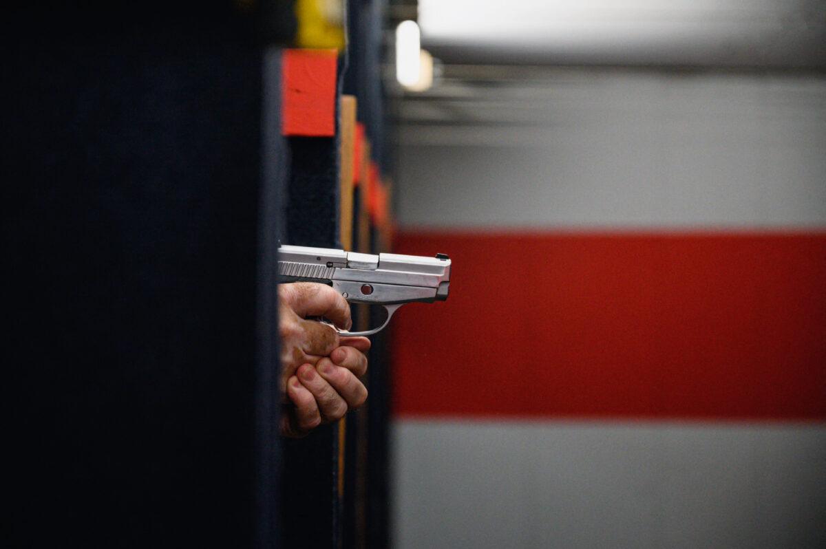 Shooting range owner John Deloca aims his pistol down range in Queens, New York, on June 23, 2022. The U.S. Supreme Court ruled that Americans have a fundamental right to carry a handgun in public.(ED JONES/AFP via Getty Images)