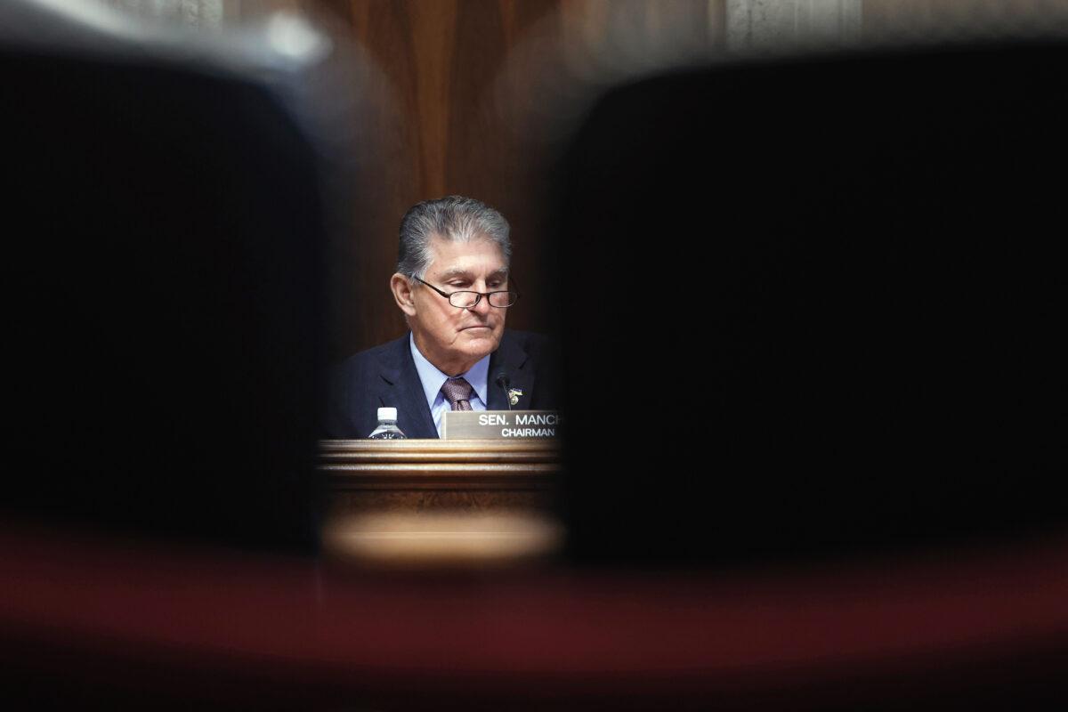 In a reversal, Sen. Joe Manchin (D-W.Va.) announces that he has reached a deal with Senate Majority Leader Chuck Schumer (D-N.Y.) that would further the climate and energy agenda of the Biden administration on July 27, 2022. (Anna Moneymaker/Getty Images)