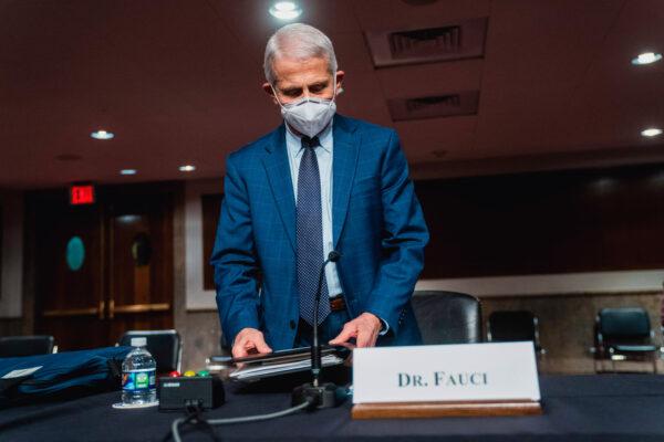 Dr. Anthony Fauci, White House chief medical adviser and director of the National Institute of Allergy and Infectious Diseases, arrives for a Senate Health, Education, Labor, and Pensions Committee hearing to examine the federal response to COVID-19 and new emerging variants at Capitol Hill on Jan. 11, 2022. (Shawn Thew/AFP via Getty Images)