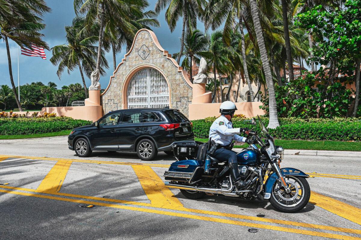 Law enforcement officers in front of former President Donald Trump's home at Mar-A-Lago in Florida on Aug. 8, 2022. President Trump said his residence was "raided" by FBI agents in what he calls an act of "prosecutorial misconduct." (Giorgio Viera/AFP via Getty Images)