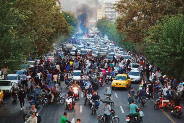 Iranian demonstrators take to the streets of the capital Tehran during a protest for Mahsa Amini on Sept. 21, 2022, five days after the young woman died in custody while under arrest by the country's morality police. (AFP via Getty Images)