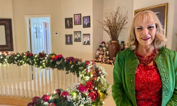Sylvia Nash at her elaborately decorated home with 85 Christmas trees, thousands of twinkling lights, 300 Santa Clauses, among other elements in Chino Hills, Calif., on Dec. 16, 2022. (Carol Cassis/The Epoch Times)