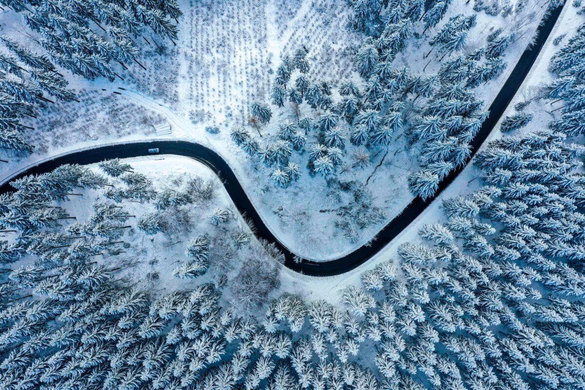 An aerial view shows a snow-covered landscape on a sunny winter day near Winterberg, Germany, on Jan. 6, 2022. (INA FASSBENDER/AFP via Getty Images)
