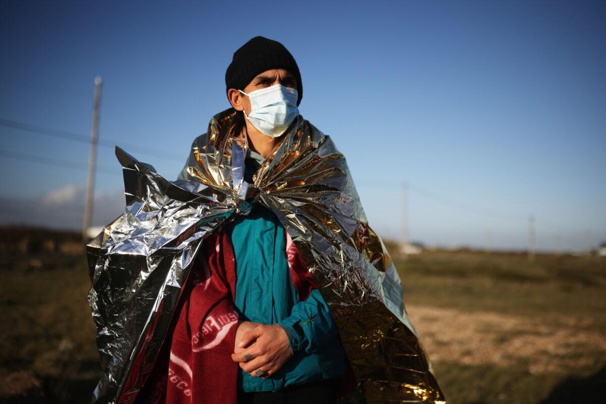 A migrant arrives in England after being intercepted in the English Channel by the UK Border Force, on Jan. 18, 2022. (Dan Kitwood/Getty Images)