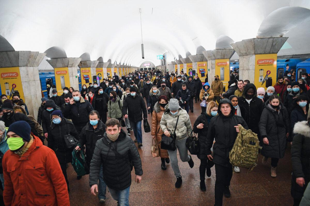 Civilians gather at a metro station in Kyiv, Ukraine, on Feb. 24, 2022, after Russian President Vladimir Putin announced a military operation and explosions sounded. Russia's foreign minister said a "full-scale invasion" was underway. (DANIEL LEAL/AFP via Getty Images)