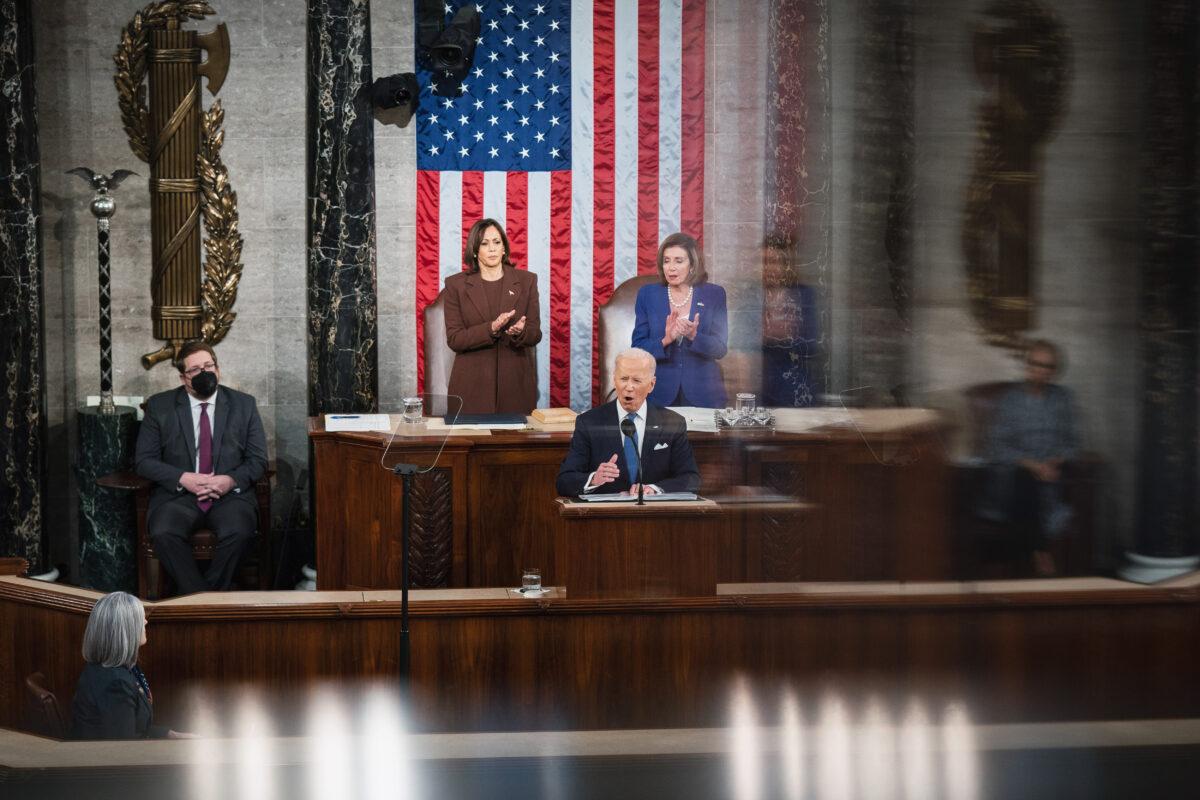President Joe Biden gives his first official State of the Union Address at the U.S. Capitol as Vice President Kamala Harris and House Speaker Nancy Pelosi applaud behind him, on March 1, 2022. (Sarahbeth Maney-Pool/Getty Images)