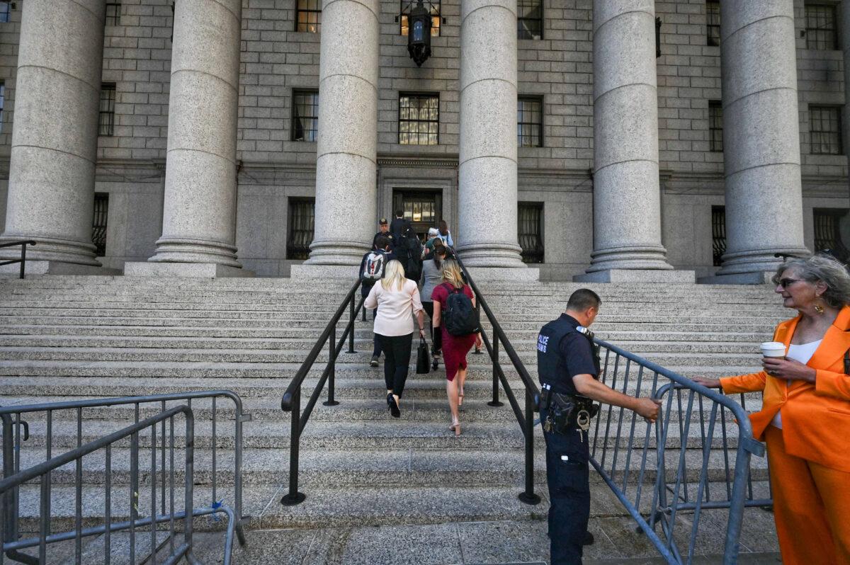 Spectators arrive at court in New York for the sentencing hearing of Ghislaine Maxwell, on June 28, 2022. Maxwell received a 20-year sentence for charges related to sex trafficking and sexual abuse. (ED JONES/AFP via Getty Images)