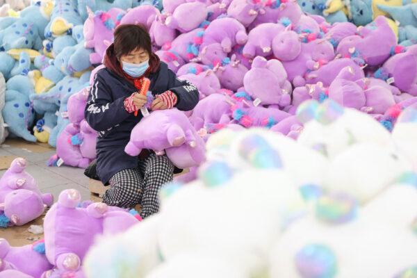 A worker producing stuffed toys at a factory in Lianyungang, in China's eastern Jiangsu Province on Dec. 15, 2022. (STR/AFP via Getty Images)
