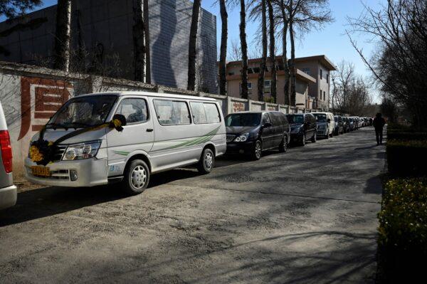 Hearses are seen waiting to enter a crematorium in Beijing on Dec. 22, 2022. (STF/AFP via Getty Images)