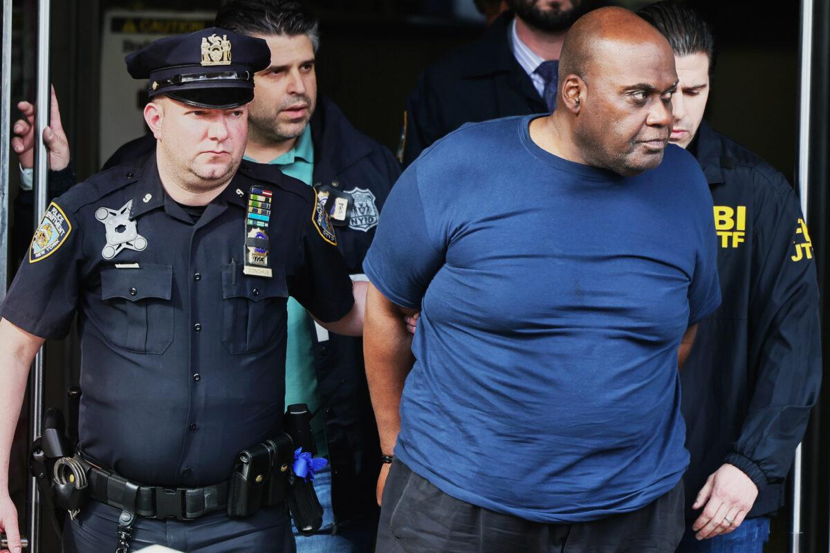 Suspect Frank James is arrested in connection with the April 12 subway attack during rush hour on April 13, 2022. Ten people were shot, with five sustaining critical injuries. (Michael M. Santiago/Getty Images)