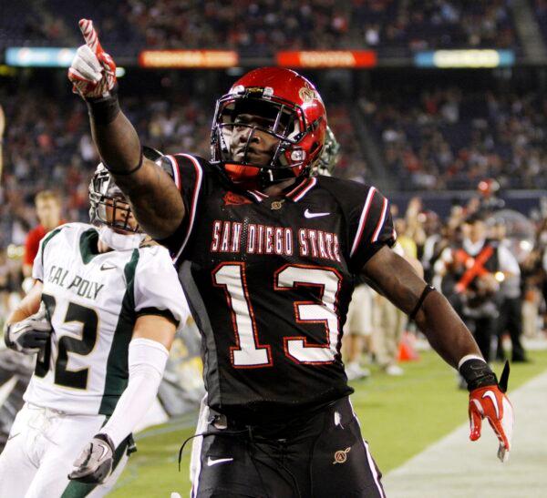 San Diego State running back Ronnie Hillman celebrates his 27-yard touchdown run in the fourth quarter of an NCAA college football game against Cal Poly in San Diego on Sept. 3, 2011. (Chris Park/AP Photo)