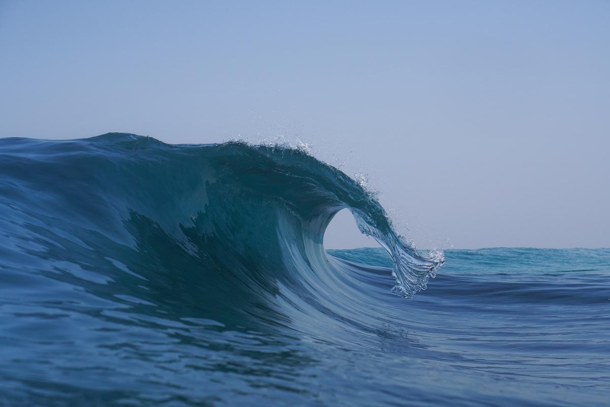 A wave breaking elegantly appears frozen in time. (Courtesy of <a href="https://www.instagram.com/orangerocks.za/">Terence Pieters</a>)