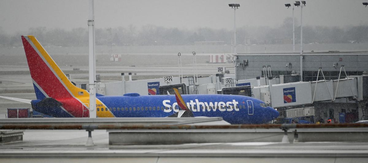 A plane sits on the airfield as flight cancellations mount during a cold weather front as a weather phenomenon known as a bomb cyclone hits the Upper Midwest, at Midway International Airport in Chicago on Dec. 22, 2022. (Matt Marton/Reuters)