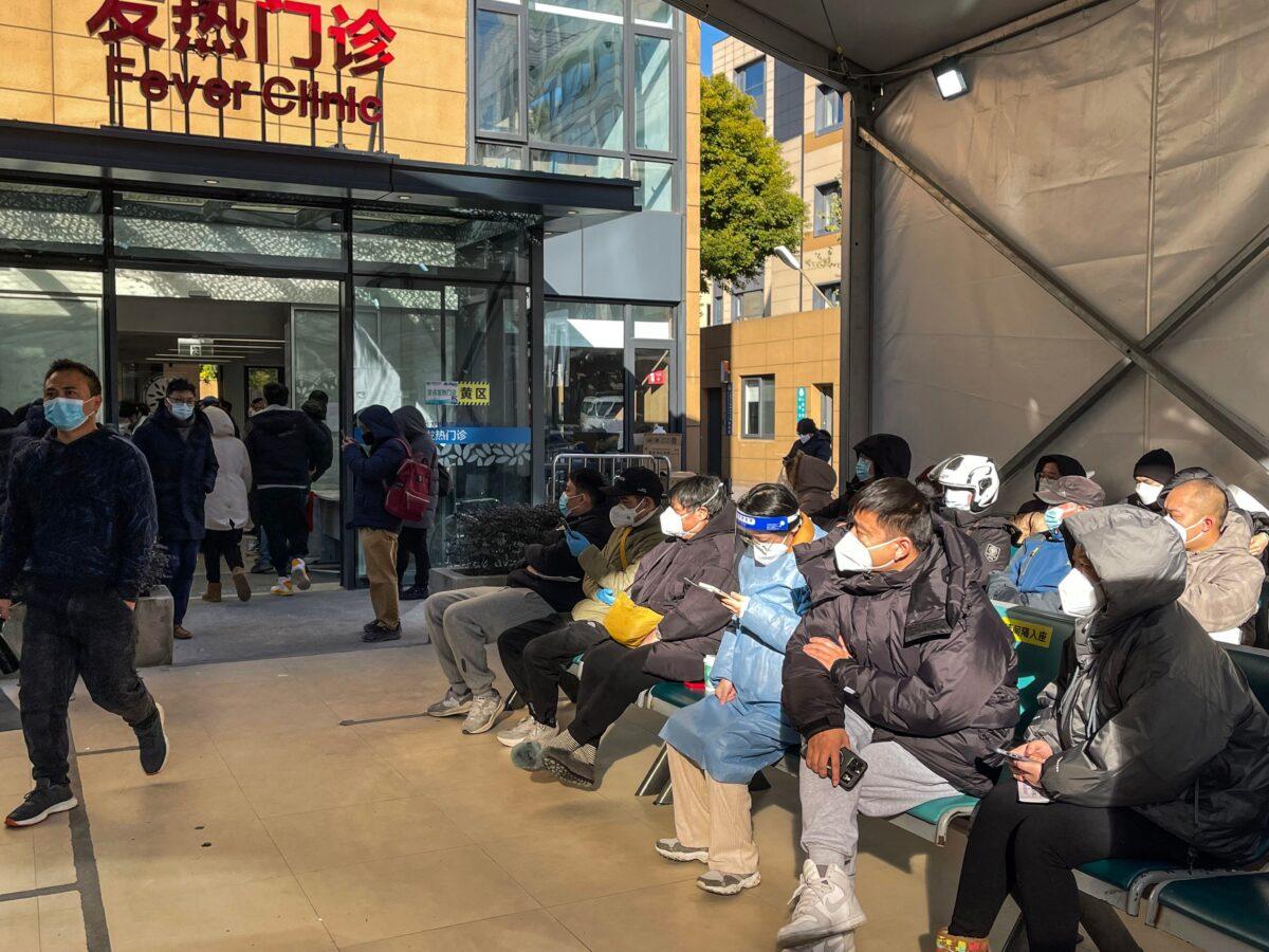 People wait for medical attention at a Fever Clinic area in Tongren Hospital in the Changning district in Shanghai, on Dec. 23, 2022. (Hector Retamal/AFP via Getty Images)