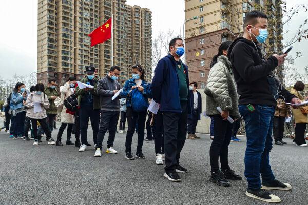 Residents line up to receive the COVID-19 vaccine at the Community hospital on March 23, 2021, in Wuhan, Hubei Province, China. (Getty Images)