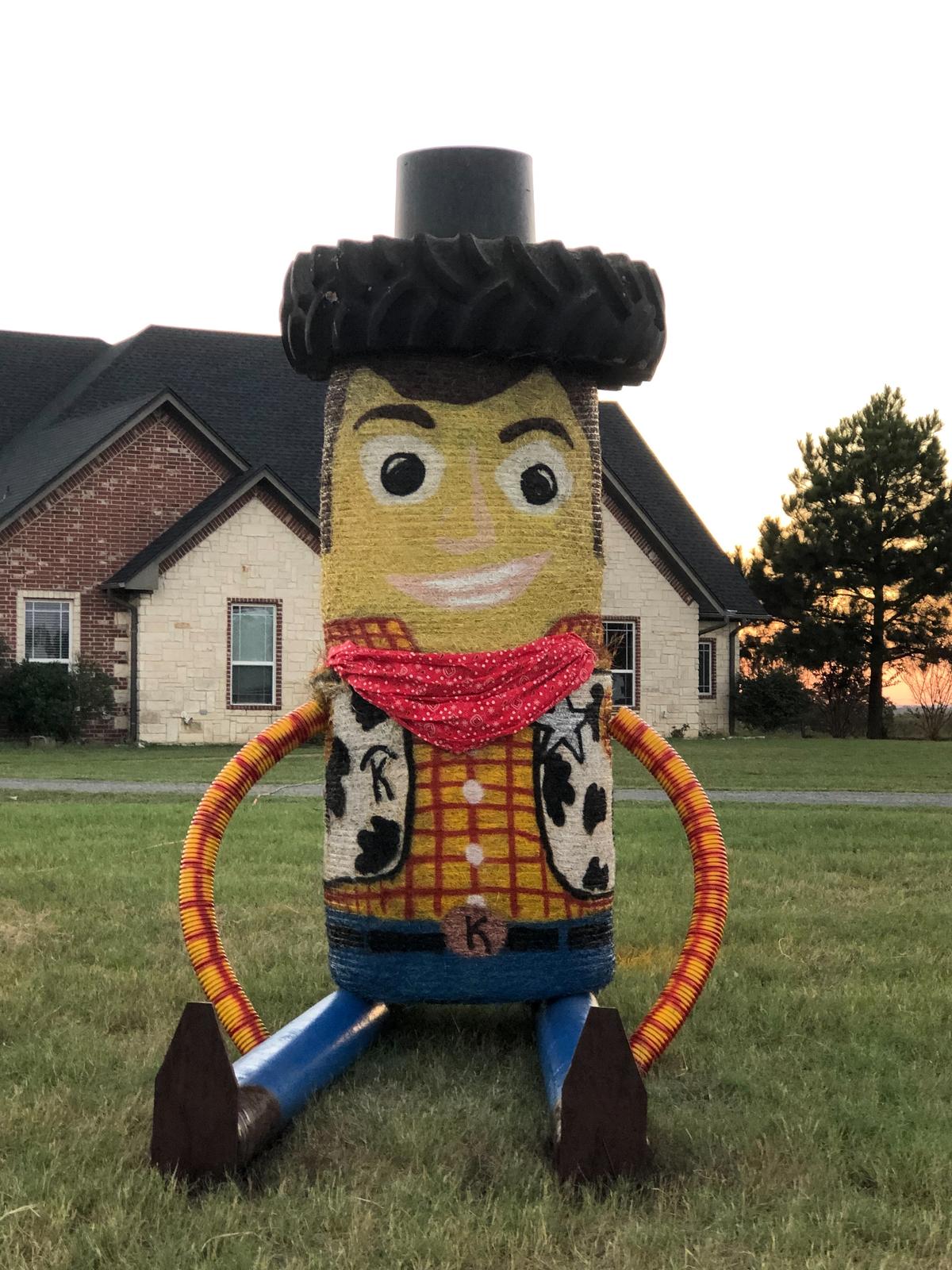 A hay bale sculpture of "Woody," from Toy Story. (Courtesy of <a href="https://www.facebook.com/groups/320200669469831/">Melissa Kelley</a>)