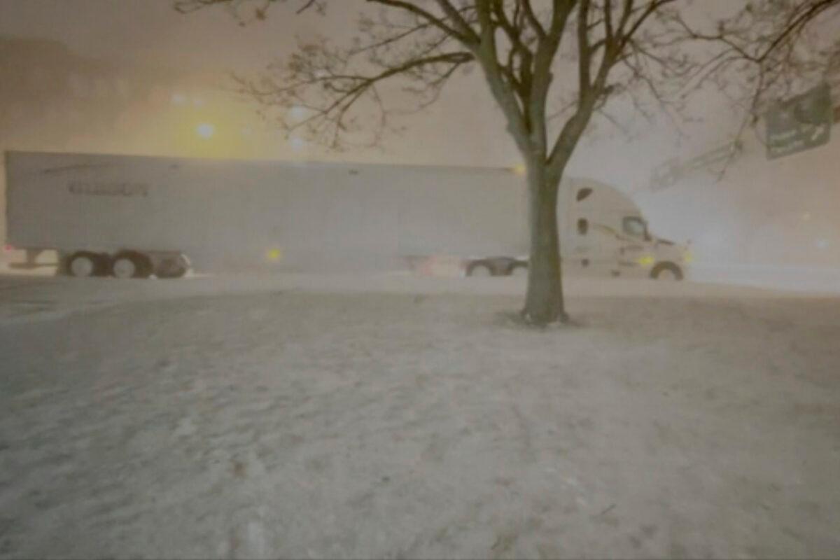 High winds and snow covers the streets and vehicles in Buffalo, N.Y., on Dec. 25, 2022. (WKBW via AP)