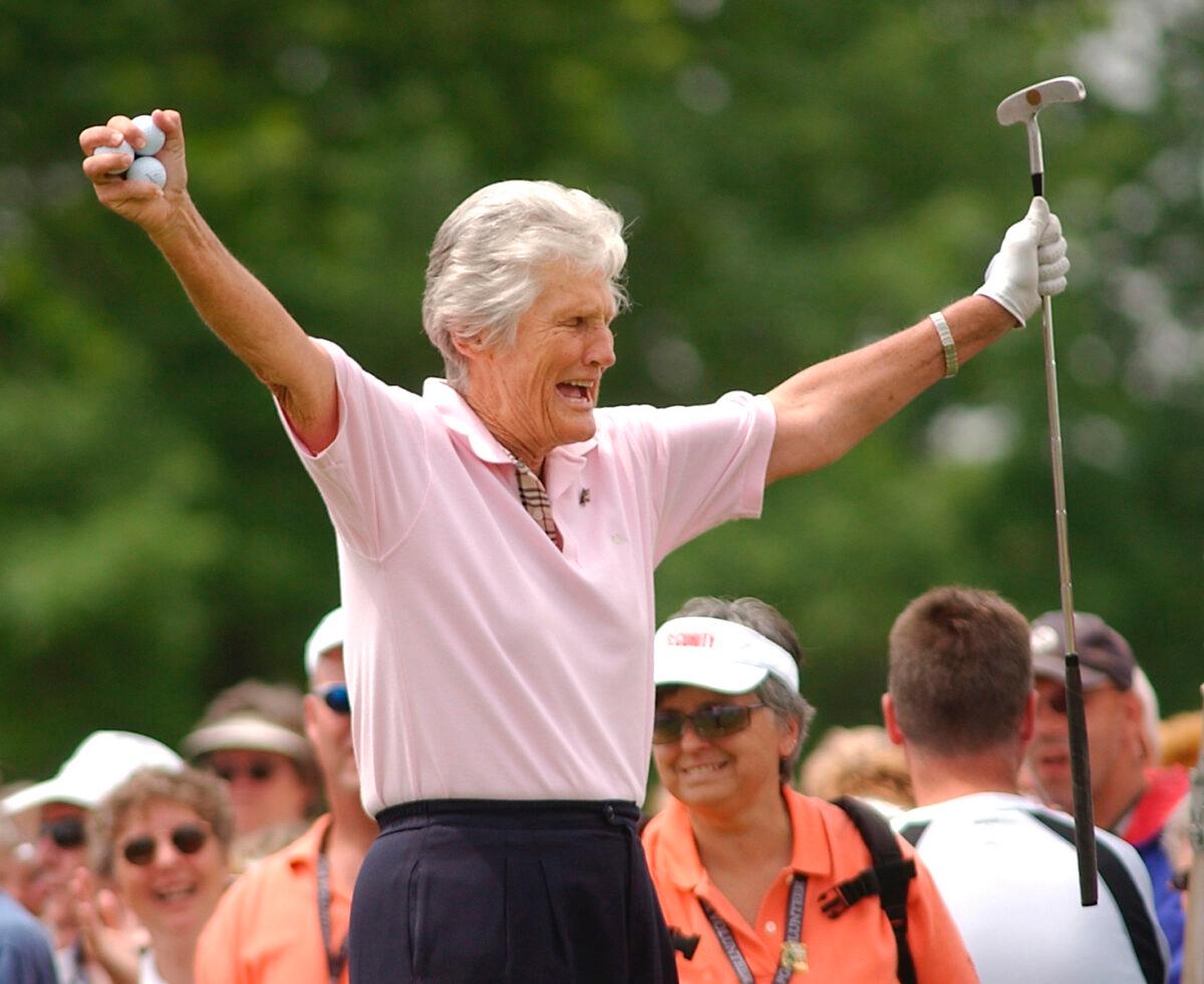 Kathy Whitworth responds to the crowd as she prepares to tee off during the Tournament of Champions golf tournament at Locust Hill Country Club in Pittsford, N.Y. on June 20, 2006. (Carlos Ortiz/Democrat Chronicle via AP)