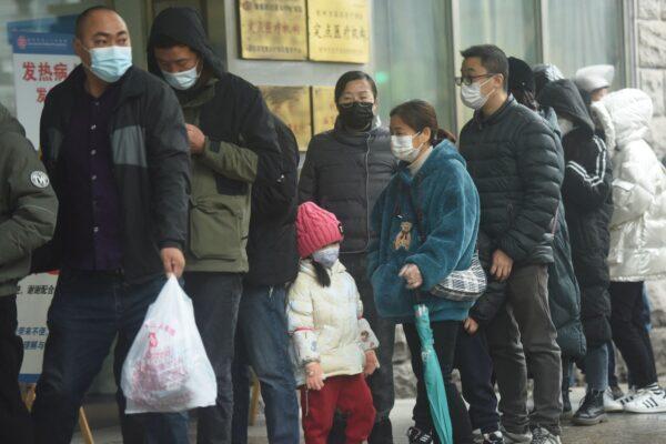 People line up to be tested for COVID-19 outside a hospital in Hangzhou, Zhejiang Province, on Dec. 16, 2022. (STR/AFP via Getty Images)