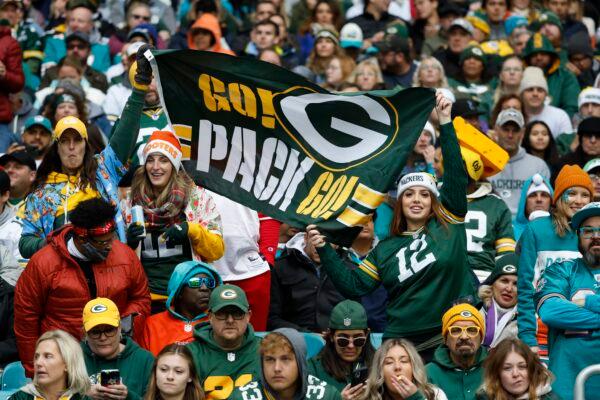 Green Bay Packers fans cheer on their team during the first half of an NFL football game against the Miami Dolphins in Miami Gardens, Fla., on Dec. 25, 2022. (Rhona Wise/AP Photo)