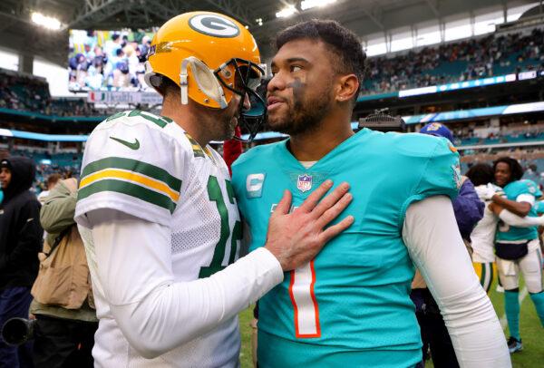 Aaron Rodgers (12) of the Green Bay Packers hugs Tua Tagovailoa (1) of the Miami Dolphins on the field after the game at Hard Rock Stadium in Miami Gardens, Flor., on Dec. 25, 2022. (Megan Briggs/Getty Images)