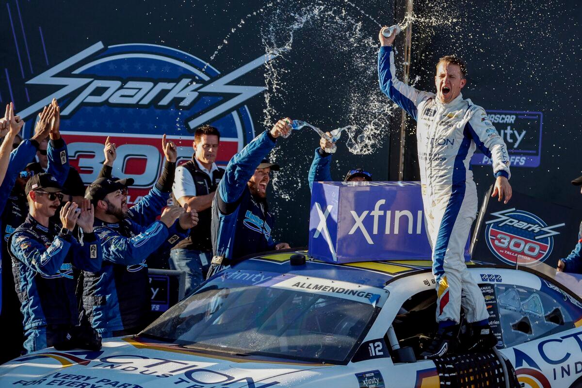 AJ Allmendinger (R) celebrates in Victory Lane after winning a NASCAR Xfinity Series auto race in Talladega, Ala., on Oct. 1, 2022. (Butch Dill/AP Photo)