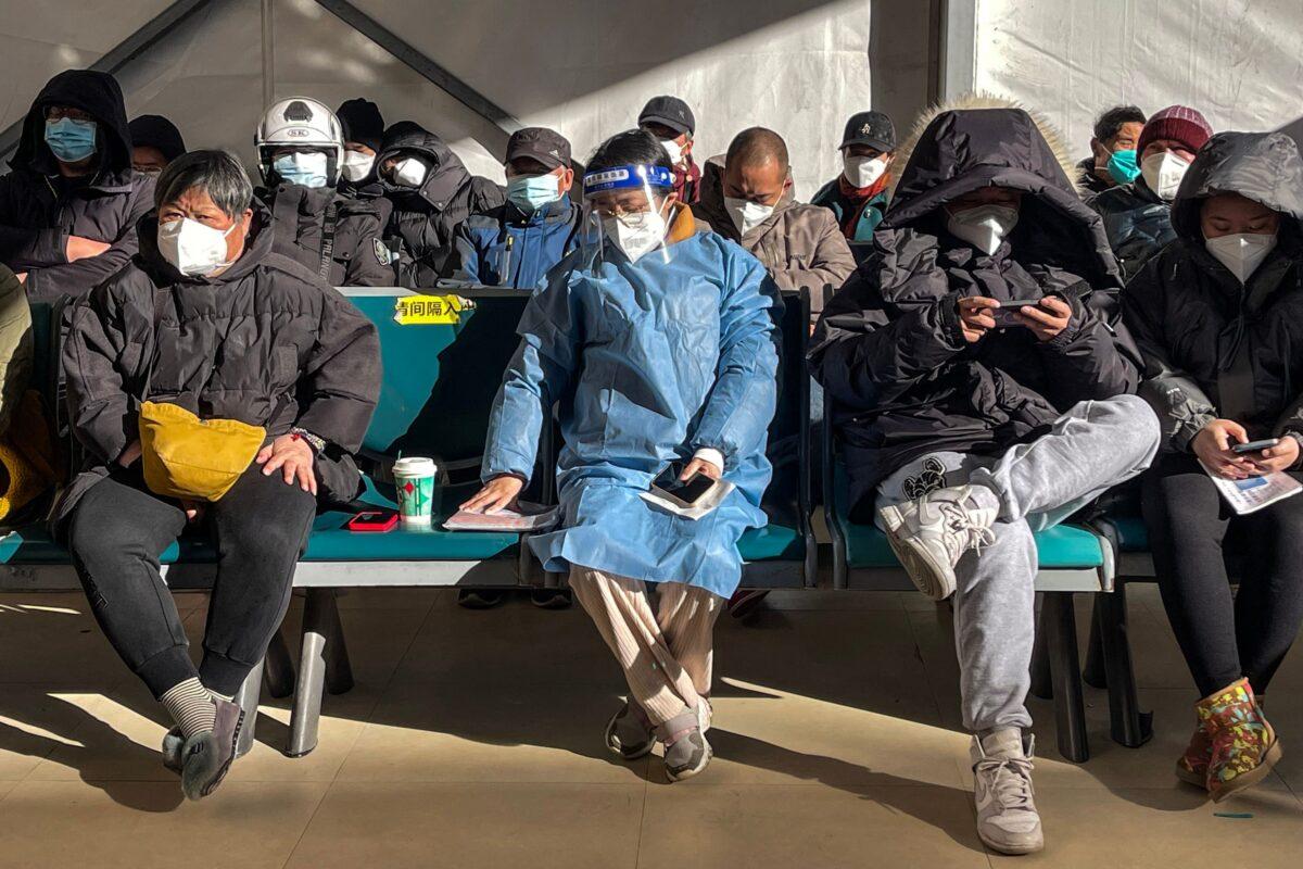 People wait for medical attention at Fever Clinic area in Tongren Hospital in the Changning district in Shanghai, on Dec. 23, 2022. (Hector Retamal/AFP via Getty Images)