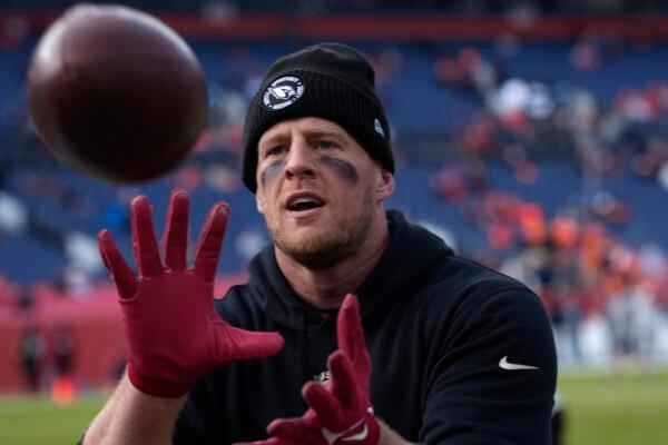 Arizona Cardinals defensive end J.J. Watt plays catch with fans prior to an NFL football game against the Denver Broncos in Denver on Dec. 18, 2022. (David Zalubowski/AP Photo)