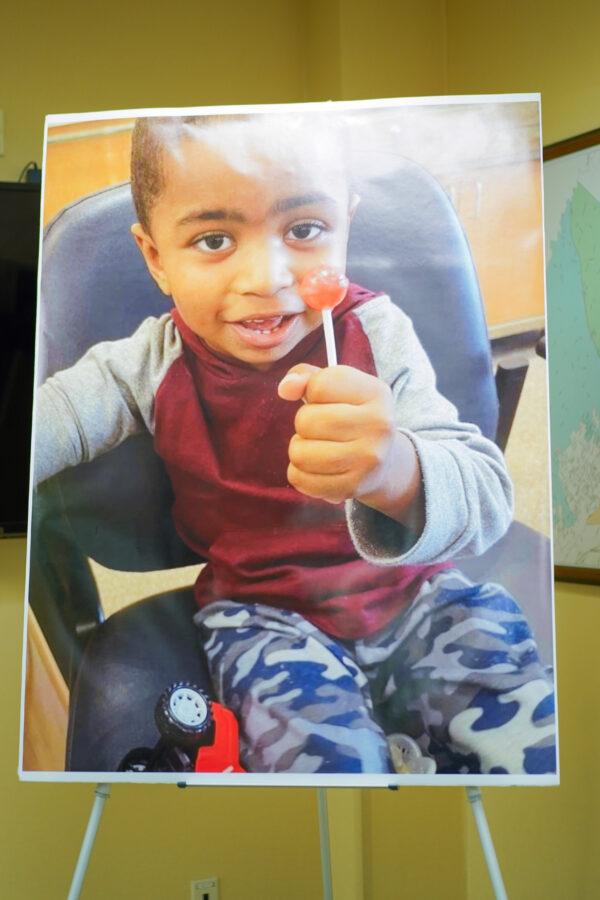 A picture of 3-year-old Xavier Johnson is on display at a press conference at Wallkill Police Department in N.Y. on Dec. 27, 2022. (Cara Ding/The Epoch Times)