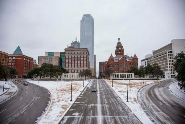 Cars drive through downtown in Dallas, United States, on Feb. 3, 2022. (Emil Lippe/Getty Images)