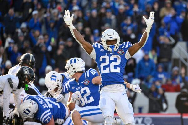 Duke running back Jaylen Coleman (22) reacts to a rushing touchdown score by quarterback Riley Leonard during the first half of the Military Bowl NCAA college football game against UCF, in Annapolis, Md., on Dec. 28, 2022. (Terrance Williams/AP Photo)