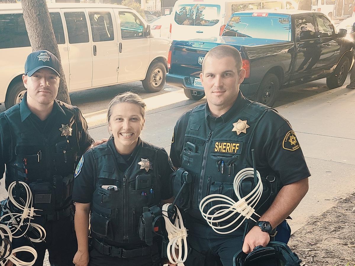 Officer Terra Avilla poses beside two of her coworkers. (Courtesy of <a href="https://www.instagram.com/the_girlcop/">Terra Avilla</a>)