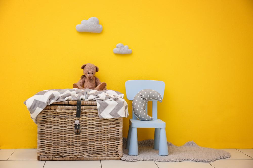 Designating a tote, chest, drawer, or bin for the children's toys will help keep the house clean and teach them organization skills at the same time. (Africa Studio/Shutterstock)