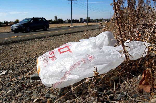 A plastic bag sits along a roadside in Sacramento, Calif., in a file photo. (Rich Pedroncelli/AP Photo)