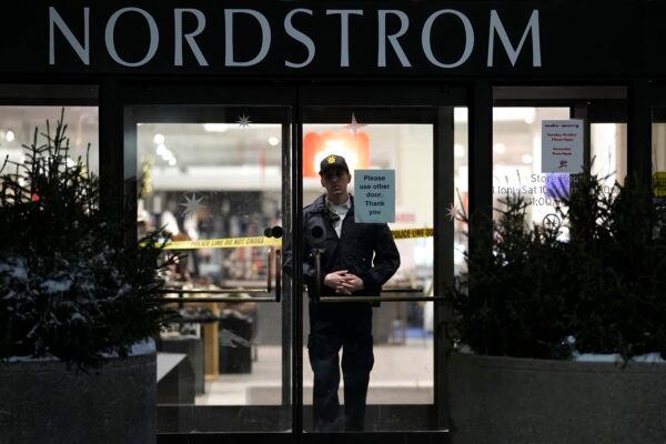 An officer stands inside Nordstrom at Mall of America after a shooting in Bloomington, Minn., on Dec. 23, 2022. (Abbie Parr/AP Photo)