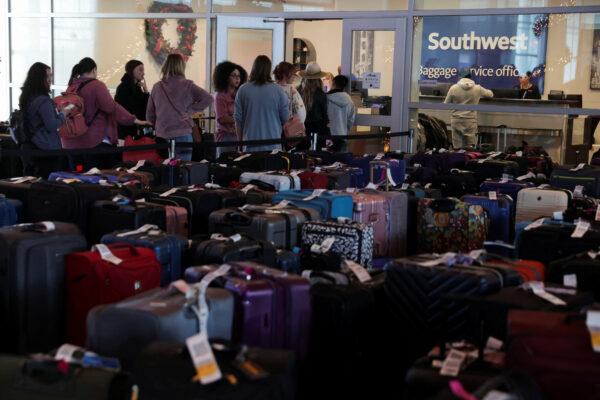 Southwest Airlines passengers wait in line at the baggage services office after U.S. airlines, led by Southwest, canceled thousands of flights due to a massive winter storm which swept over much of the country before and during the Christmas holiday weekend, at Dallas Love Field Airport in Dallas on Dec. 28, 2022. (Shelby Tauber/Reuters)