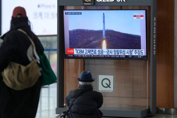 A TV screen shows a file image of North Korea's rocket with the test satellite during a news program at the Seoul Railway Station in Seoul, South Korea, on Dec. 31, 2022. (Lee Jin-man/AP Photo)