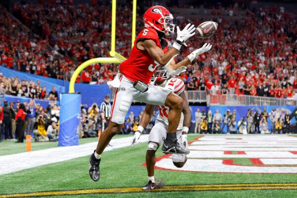 Adonai Mitchell (5) of the Georgia Bulldogs catches a touchdown pass during the fourth quarter against the Ohio State Buckeyes in the Chick-fil-A Peach Bowl at Mercedes-Benz Stadium in Atlanta on Dec. 31, 2022. (Todd Kirkland/Getty Images)