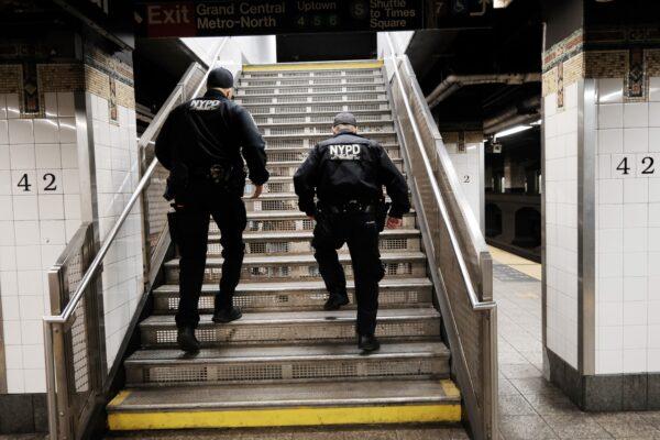 Police search for a suspect in a Times Square subway station following a call to police from riders in New York on April 25, 2022. (Spencer Platt/Getty Images)