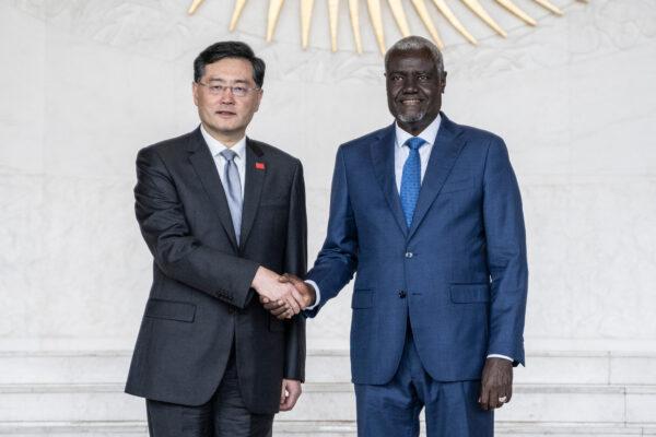 China's Foreign Minister Qin Gang (L) and Moussa Faki (R), Chairperson of the African Union (AU) Commission, shake hands during their meeting at the Africa Union headquarters in Addis Ababa, Ethiopia, on Jan. 11, 2023. (Amanuel Sileshi/AFP via Getty Images)