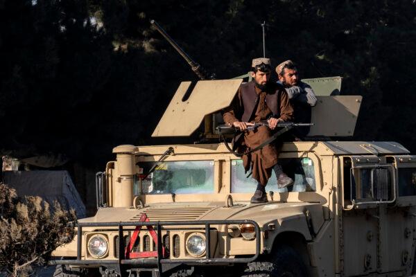 Taliban fighters stand guard at the site of an explosion near the Interior Ministry, in Kabul, Afghanistan, on Jan. 1, 2023. (Ebrahim Noroozi/AP Photo)
