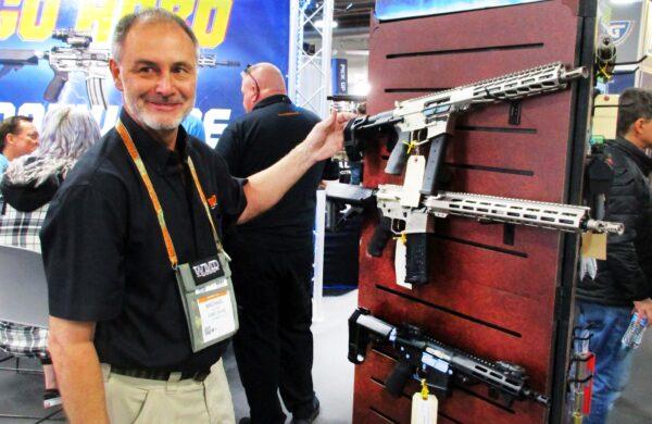 Michael Vetter of WMD Guns in Stuart, Fla., displays some of the firearms his company offers that come equipped with pistol stabilizing braces during the 2023 SHOT Show in Las Vegas. (Michael Clements/The Epoch Times)
