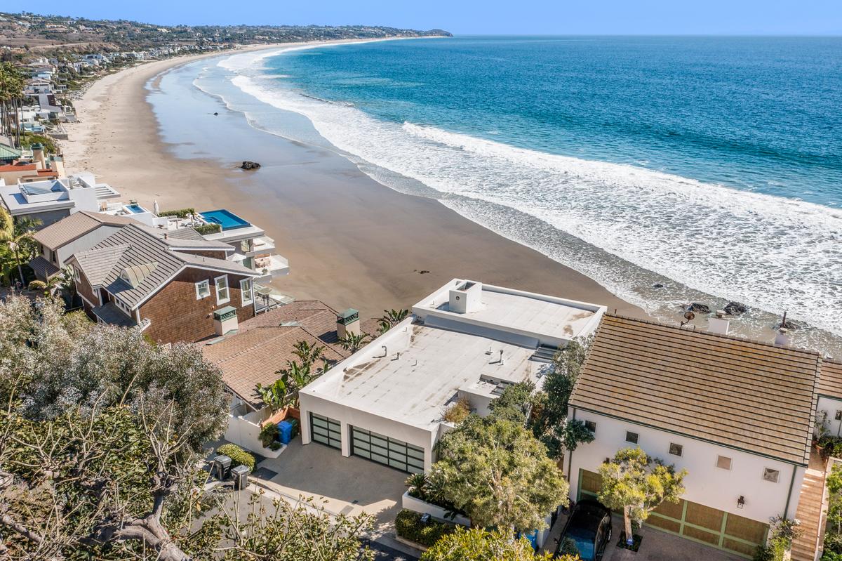 Due to its location right on the beach, the home features a three-car garage to protect vehicles from the salty environment. (The Luxury Level, Toptenrealestatedeals.com)