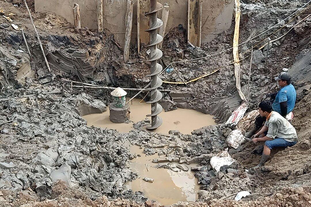 Rescuers in Vietnam Try to Save Boy Trapped in Concrete Pile