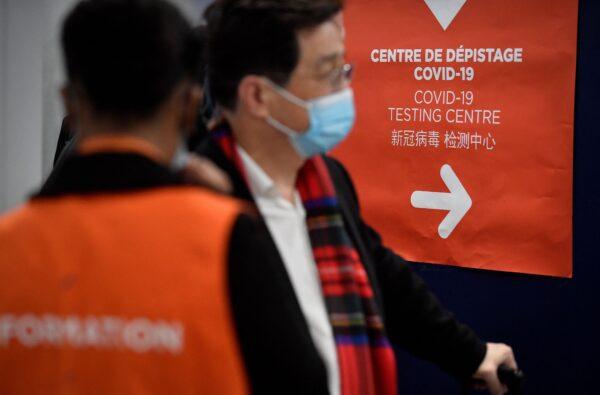 Travelers on a flight from China enter the COVID-19 testing center of the Paris-Charles-de-Gaulle airport in Roissy, outside Paris, as France reinforces health measures at the borders for passengers arriving from China, on Jan. 1, 2023. (Julien De Rosa/AFP via Getty Images)