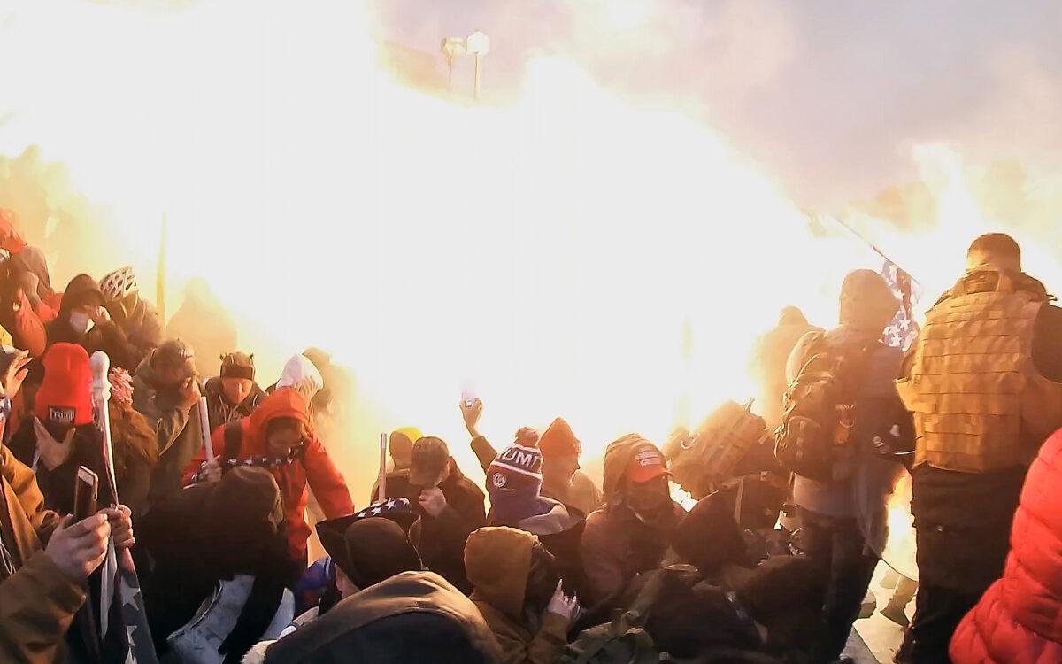 Police incendiary munitions drive protesters from the Lower West Terrace of the U.S. Capitol on Jan. 6, 2021. (Special to The Epoch Times)